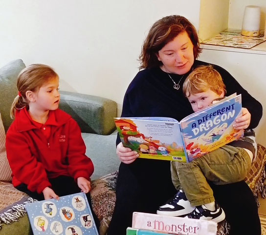 april Mum and Kids reading stories together.