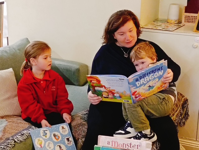 A mother reading stories to her two children